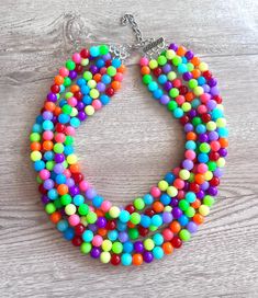 A beaded statement necklace made with multi color neon lucite beads. The color placement will vary on the one you will receive.- 6 Strands - more are listed- Shortest strand is 18.5-20.5" long- Stainless steel lobster claw clasp (sterling silver, gold filled, gold stainless steel also available)- 2" stainless steel extender chain- Lead free multi strand connector- 10mm beadsA chunky but rather light weight necklace. For reference, the mannequin's neck size is 14.5". Larger quantities may be available. We use the highest quality findings to ensure a piece that will last for years to come. DLD jewelry comes with a lifetime guaranteeDana LeBlanc Designs- Handmade Jewelry Multi Coloured Necklaces, Chunky Bead Necklaces, Silver Jewelry Box, Necklace Chunky, Chunky Beads, Beaded Statement Necklace, Chunky Necklace, Multi Strand, Lobster Claw