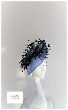 Striking oversized petal in gorgeous deep powder blue sinamay.  Adorned with a navy diamond tip feather fan and starburst centre flower and blue goose biot.  The underside is adorned with double starburst flowers, with contrasting blue goose biot, creating interest from all angles - a true head turner.  Perfect for Weddings, Racemeetings and special occasions.  Sits on a headband This item has sold, however, similar pieces can be made in a variety of colours.  Please ask for details.  As every p Starburst Flowers, Bride Fascinator, Oaks Day, Fashion Competition, Red Fascinator, Bride Hat, Feather Fan, Wedding Hat, Elegant Hats