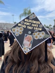 a graduation cap that says, wildflowers don't care where they grow