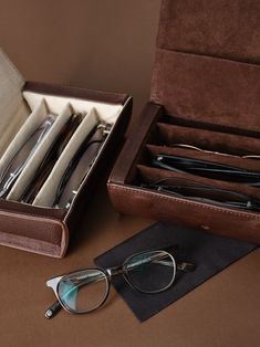 Created by our masterful artisans with the finest materials and outstanding attention to detail, our Leather Multiple Sunglasses Travel Case is the perfect accessory along your journey. A semi hard case with four compartments protects your glasses from scratches and shocks thrown your way. Easy to carry, individual padded dividers, wide opening, and magnetic access closure. Simple, sophisticated, and practical. Modern Rectangular Organizers With Interior Card Slots, Classic Portable Cases For Everyday Use, Modern Rectangular Travel Storage Case, Classic Portable Cases For Storage, Classic Round Case For Daily Use, Rectangular Case With Interior Card Slots For Daily Use, Classic Rectangular Storage Cases, Classic Cases With Pen Slots For Daily Use, Modern Round Storage Case