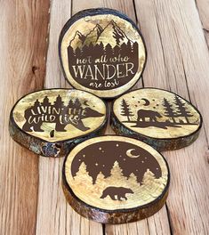 four wooden coasters with the words, not all who wander are lost on them