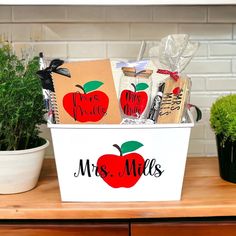 a teacher's gift basket with personalized items on the front and back side