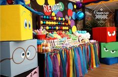 a colorful birthday party with balloons, streamers and decorations