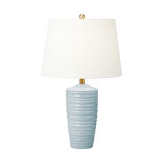 a blue lamp with a white shade on it