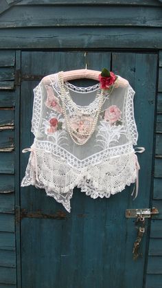 Gorgeous romantic pretty white lace layering top. This has an oversized look and could fit a few sizes depending on how loose you may want to wear it.. This beauty has been reworked and features a wide scooped neckline and exaggerated wide cap sleeves. This has a white sheer base and I have added vintage style appliques to the front and back; cherubs and florals. At the hemline, various vintage mats and doilies have been added, including a "Brugges" lace mat. This has an uneven hemline with ligh Lace Diy Projects, Layered Lace Top, Top Layering, Lace Doily, Scooped Neckline, Lace Doilies, Layered Tops, Over Sized, Lace Insert