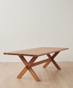 a wooden table sitting on top of a hard wood floor