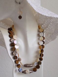 Mother Of Pearl Strand Necklace Tiger Eye by LiaJewelryDesigns Brown Jewelry With Polished Round Beads, Brown Natural Stones Round Jewelry, Brown Round Gemstone Beads Jewelry, Artisan Brown Round Jewelry, Mother Of Pearl Jewelry With Natural Stones, Bohemian Mother Of Pearl Round Bead Jewelry, Spiritual Round Mother Of Pearl Jewelry, Round Mother Of Pearl Jewelry With Natural Stones, Bohemian Mother Of Pearl Round Jewelry