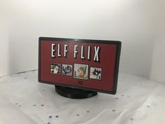 a sign that says elfflix with pictures on it