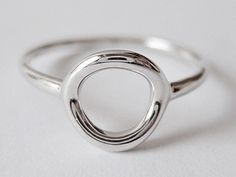 SMALL CIRCLE RING This small circle ring is very chic and great to wear everyday. It's lightweight and comfortable. The circle has a very meaningful shape; it has no beginning and no end, the symbol of eternity. Wear this ring to empower yourself and as a reminder of the never ending love of the people in your life. Made from sterling silver with rhodium plating. Details: ♥ 925 Sterling silver ♥ Hypoallergenic ( Nickel free ) All jewelry comes in beautiful packaging, ready to give, just perfect Minimalist Silver Stackable Circle Rings, Minimalist Circle Midi Rings For Everyday, Minimalist Midi Rings For Everyday, Minimalist Everyday Open Circle Ring, Minimalist Open Circle Ring For Everyday, Everyday Minimalist Open Circle Ring, Minimalist Open Circle Stackable Rings, Minimalist Open Circle Midi Rings For Everyday, Modern Everyday Stackable Rings With Open Circle