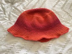 A crocheted bucket hat inspired by Ashton Irwin. Adjustable sizing, acrylic yarn, hand made, high quality. Handmade Orange Crochet Hat For Beach, Handmade Orange Crochet Beach Hat, Handmade Casual Orange Crochet Hat, Handmade Orange Beanie Hat, Handmade Orange Crochet Beanie Hat, Handmade Red Crochet Bucket Hat, Red Yarn Bucket Hat, Orange Crochet Hat, One Size, Orange Crochet Hat, One Size Fits Most