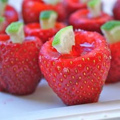 strawberries with lime slices on them are ready to be eaten