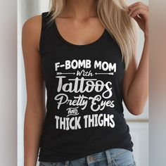 - Trendy - Chic - Cozy Black Graphic Tee Tank Top With Letter Print, Black Text Print Tank Top, Trendy Black Tank Top With Text Print, Edgy Black Letter Print Tank Top, Edgy Black Tank Top With Letter Print, Black Trendy Tank Top With Relaxed Fit, Trendy Black Relaxed Fit Tank Top, Black Relaxed Fit Trendy Tank Top, Trendy Chic