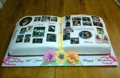 an open book cake decorated with photos and flowers