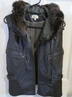 Women’s June Nordstrom Brown Leather Vest Fur Trim Removable Hood Silk Lined XS EXACT ITEM IS PICTURED ABOVE. EXCELLENT CONDITION!! GENUINE LEATHER. SILK LINING. GENUINE FUR TRIM ON HOOD. FREE SHIPPING IN THE 50 STATES! DELIVERY CONFIRMATION IS ALWAYS INCLUDED! WE SHIP ALL ITEMS WITHIN 1 BUSINESS DAY. WE DO NOT SHIP ON WEEKENDS OR HOLIDAYS WHEN THE POST OFFICE IS CLOSED. WE OFFER RETURNS ON MOST ITEMS. PLEASE VIEW OUR RETURN POLICY PRIOR TO PURCHASING. WE DO NOT CANCEL PURCHASES FOR ANY REASON Apocalyptic Fashion Women Outfits, Werewolf Fashion, Military Style Winter Outerwear For Cosplay, Hunter Clothes, Fur Lined Leather Jacket, Brown Leather Vest Hood, Dystopian Clothes, Brown Leather Vest, Long Leather Jacket Fur Collar