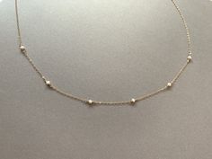 "Here is our new delicate pearl choker necklace! This is an absolute must have! It's so elegant and will go with so many cute outfits. It's also the perfect gift for yourself, any loved one, and also your awesome bridesmaids! So dainty and delicate this is our new favorite. P.s. pearl is the birthstone for the month of June<3 ------- Tiny Pearl Necklace, Freshwater Pearl Necklace, Freshwater Pearl Choker, Dainty Pearl Choker, Delicate Pearl Necklace, Bridesmaid Gifts, June birthstone ------- Dainty Pearl Necklace With Satellite Chain, Elegant Satellite Chain Choker As Gift, Delicate Pearl Charm Choker, Delicate Pearl Chain Choker As Gift, Delicate Pearl Chain Choker For Gift, Tiny Pearl Necklace, Lapis Pendant, Month Of June, Buying Gold