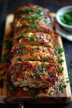 Slices of glazed meatloaf garnished with fresh herbs on a wooden cutting board. Flavorful Ground Turkey Recipes, Turkey Ranch Meatloaf, Ground Turkey Halloween Recipes, Meatloaf With Onion Soup Mix Lipton Ground Turkey, Dinner Idea Ground Turkey, Dishes To Make With Ground Turkey, Dinner Ideas With Turkey Ground, Healthy Meals For The Whole Family