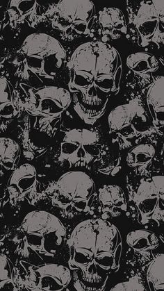 a bunch of skulls that are all over the place with black and white paint on them