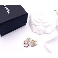 Chanel Brand New Gold CC Crystal 5 Asymmetrical Piercing Earrings  *Marked 21 *Made in France *Comes with original box, pouch, ribbon and camellia *Brand new  -Approximately 0.75″ x 0.75″ -Very unique and classic  3241-44237  Please see the measurements section for best approximate dimensions. Prada Jewelry, Chanel Brand, Box Pouch, Piercing Earrings, Cartier Ring, Vintage Cartier Bracelet, Dior Ring, Vintage Cartier, Dior Bag