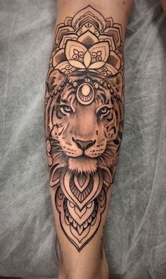 a person with a tiger tattoo on their leg