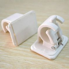 an image of a pair of white kitchen gadgets on a wooden table with the words ebay below it