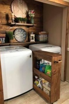 a small kitchen with a washer and dryer in the corner next to a wall mounted clock