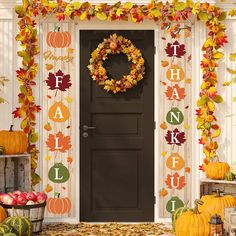 a front door decorated with fall leaves, pumpkins and an autumn wreath that says thank you