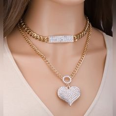 This Beautiful Layered Necklace Will Give The Perfect Fun Touch To Any Outfit. Heart Shaped Crystal Necklace With Adjustable Chain, Gold Heart Pendant Necklace With Rhinestones, Gold Crystal Rhinestone Necklace For Valentine's Day, Valentine's Day Gold Crystal Rhinestone Necklace, Heart-shaped Clavicle Rhinestone Necklace For Valentine's Day, Heart-shaped Rhinestone Necklace For Party, Gold Crystal Heart Pendant Necklace, Gold Crystal Heart Necklace, Trendy Heart Shaped Rhinestone Jewelry