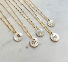 "Mother of pearl initial necklace. -------------------- Details ・16K gold plated 1 mm cable chain ・16K gold plated lace chain ・18K gold plated figaro chain -------------------- Necklace Length * This necklace is available in 3 sizes 16-18\" (16\" + adjustable 2 inch extender) 18-20\" (18\" + adjustable 2 inch extender) 20-22\"(20\" + adjustable 2 inch extender) *If you would like it shorter or longer, please feel free to send me a message: ) *It closes with lobster clasp. -------------------- Je Elegant Initial Necklace With Pearl Charm For Gifts, Elegant Initial Necklace With Pearl Charm As Gift, Personalized White Initial Pendant Necklace, Dainty White Initial Necklace Gift, Handmade Gold Initial Pendant Necklace, Elegant Handmade Initial Pendant Necklace, Elegant Handmade Pendant Initial Necklace, Elegant Handmade Gold Initial Necklace, Dainty Handmade Initial Necklace For Personalized Gift