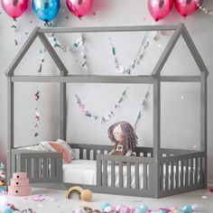 a child's bedroom with balloons and confetti