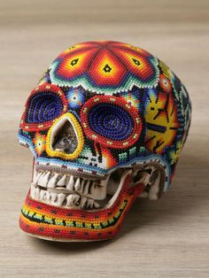 an image of a colorful skull made out of beads on the web page for pinter's blog