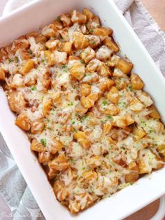 a casserole dish with chicken and cheese