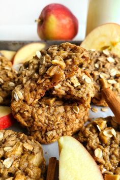 apples and oatmeal cookies are on a plate