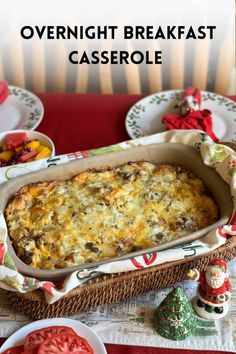 a casserole dish with cheese and vegetables in it on a red table cloth