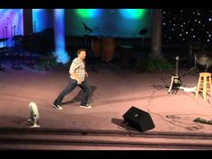 a man standing on top of a stage