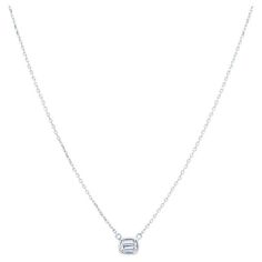 This unique and fun necklace features a 0.23 carat total weight emerald cut natural diamond that is bezel set in 14 karat white gold. It is set east west on a 14 karat white gold diamond cut adjustable chain. Wear alone or layer with your other necklaces for your own look! Lobster clasp closure. Chain adjustable from 16-18" Measurements: Pendant measures approximately 5.85mm x 5.00mm Diamond: VS1, D/E White Solitaire Necklace, White Diamond-shaped Diamond Necklace, White Solitaire Diamond Pendant Necklace, White Diamond Solitaire Pendant Necklace, White Drop-shaped Brilliant Cut Solitaire Necklace, Emerald Cut Diamond, East West, Emerald Cut Diamonds, Cool Necklaces