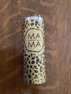 a leopard print tumbler with the word am on it