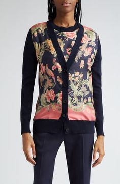 The label's signature paisley swirls are reinterpreted as a verdant floral paradise across a mixed-media cardigan boasting a sleek silk body and wool contrast. 28 1/2" length (size 8US/44IT) Front button closure V-neck Long sleeves Ribbed cuffs and hem 100% silk with 100% wool contrast Dry clean Made in Italy Designer Clothing Elegant Fitted Cardigan With Floral Print, Fitted Elegant Cardigan With Floral Print, Luxury Spring Cardigan, Floral Print Cardigan For Fall Daywear, Luxury Spring Cardigan For Formal Events, Luxury Spring Cardigan For Workwear, Luxury Spring Cardigan For Work, Statement Cardigan, Maximalist Minimalist