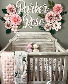 a baby crib with pink roses on it