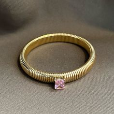 Introducing Pink Serenity - the ideal combination of sophistication and boldness! She effortlessly enhances any look, day or night, with her luxurious gold texture and brilliant CZ stone. Crafted with 18K gold plating, she is hypoallergenic and resistant to water and tarnishing, making her the ultimate go-to bracelet for any occasion. Affordable Pink Bohemian Bracelets, Affordable Nickel-free Pink Bracelets, Luxury Pink Hand-strung Beaded Bracelets, Elegant Luxury Pink Beaded Bracelets, Luxury Pink Gold Bracelets, Modern Pink Gold Luxury Bracelets, Modern Luxury Pink Gold Bracelets, She Is Perfect, Cz Bracelet