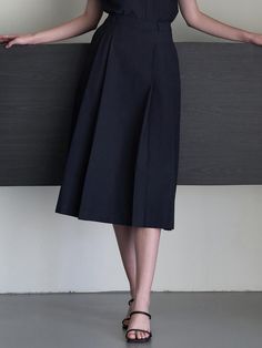 Classic mood skirt that made of cotton blended fabric. Featuring the pin tuck detail throughout the skirt, and the A-line silhouette that gives feminine mood. We recommend style with 'Sand collar blouse' to create classic set-up look. - Pin tuck detail at front and back- Console zipper closure at side seam- Midi length and A-line silhouette skirt- Set-up product with 'Sand collar blouse' Knee-length Cotton Formal Bottoms, Elegant Cotton Office Skirt, Elegant Cotton Pleated Skirt, Chic Formal Cotton Skirt, Classic Cotton Pleated Waist Skirt, Elegant Cotton Bottoms With Pleated Waist, Classic Cotton Midi Skirt, Elegant Pleated Cotton Bottoms, Classic Summer Skirt With Pleated Hem