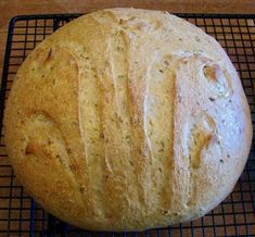 a loaf of bread sitting on top of a cooling rack