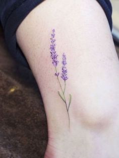 small lavender flower tattoo on the ankle