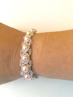 Adjustable Pink Beaded Bracelet With Silver Beads, Handmade Pearl Crystal Bracelet, Adjustable Pink Pearl Bracelet With Spacer Beads, Handmade Pink Pearl Bracelet, Adjustable Pink Jewelry With Silver Beads, Pink Adjustable Pearl Stretch Bracelet, Adjustable Pink Pearl Stretch Bracelet, Pink Beaded Pearl Bracelet For Wedding, Elegant Handmade Pink Stretch Bracelet