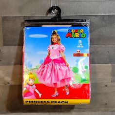 the princess peach costume is on display for children to use as a wall hanging decoration