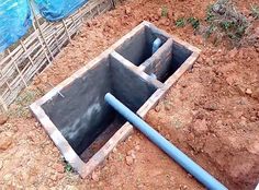 a pipe laying in the ground next to a hole