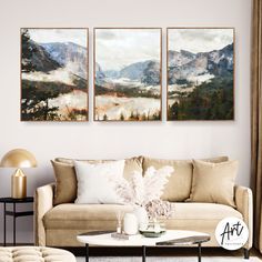 a living room with two paintings on the wall