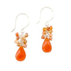 Your new carnelian earrings are one of a kind. Genuine orange carnelian gemstones are surrounded by a cluster of smaller cascading carnelian.  They can easily be dressed up or down for a casual Fall Look.  OVERVIEW These intense orange carnelian gemstones have various shades of orange throughout and are brilliantly cut for a flattering shine. They measure about 1.25 or 1 1/4 inches long. They are pictured above in 14k gold filled and can also be custom made in 14k solid gold. ◊◊What is 14k gold filled wire? 14 karat gold filled wire is 14karat gold coated over alloy metal which may contain sterling silver, brass, nickel, steel and other metals. It is not solid gold, therefore much more affordable, but still equally as beautiful and lustrous. The top layer of gold is 1000x thicker than gold Gold Carnelian Gemstone Earrings, Elegant Orange Gemstone Earrings, Orange Polished Carnelian Jewelry, Orange Carnelian Gemstone Earrings, Orange Gemstone Dangle Earrings, Carnelian Earrings, Letter Earrings, Rose Quartz Gemstone, Girls Earrings