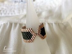 a pair of rings sitting on top of a white cloth