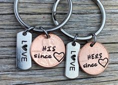 two personalized keychains with one penny and the other saying, he's since love