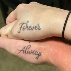 two people holding hands with the words forever and always tattooed on their wrists, both showing